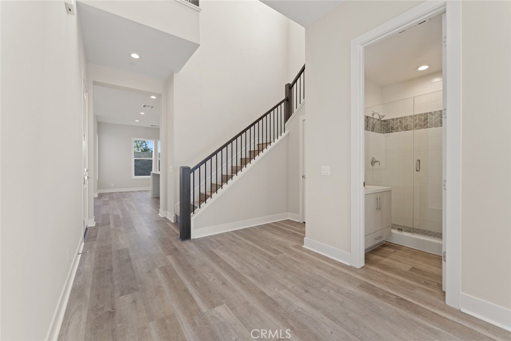 181 Hollyleaf Lake Forest, CA 92630 - Photo 2 of 36 a view of a hallway with wooden floor and staircase