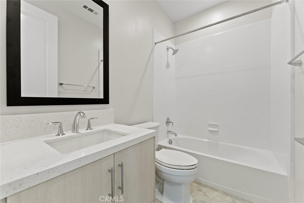 181 Hollyleaf Lake Forest, CA 92630 - Photo 28 of 36 a bathroom with a sink a toilet and shower