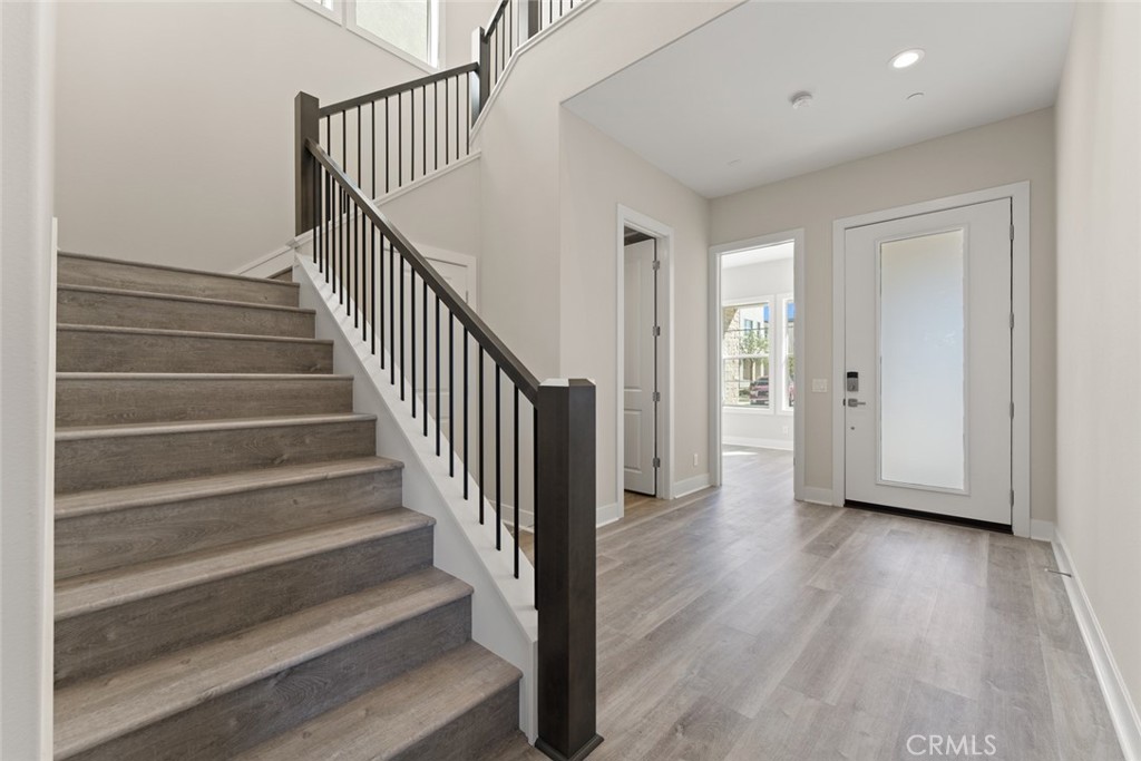 181 Hollyleaf Lake Forest, CA 92630 - Photo 3 of 36 a view of a hallway with wooden floor and entryway