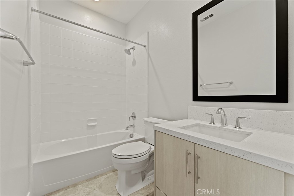181 Hollyleaf Lake Forest, CA 92630 - Photo 34 of 36 a bathroom with a toilet sink vanity tub and shower