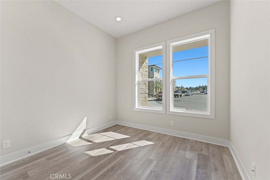 181 Hollyleaf Lake Forest, CA 92630 - Photo 5 of 36 an empty room with wooden floor and windows