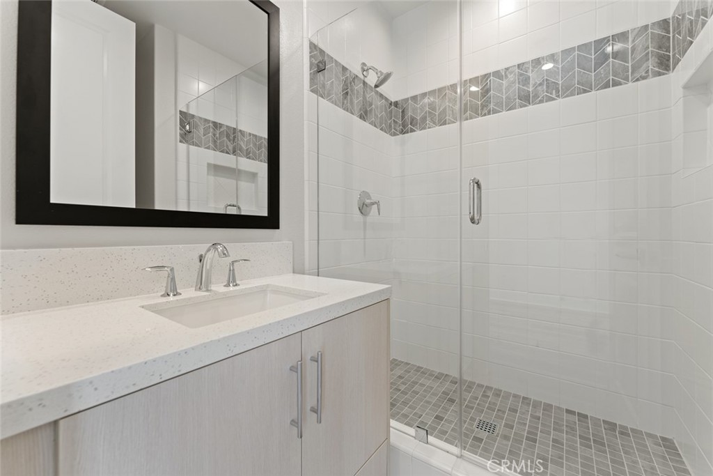181 Hollyleaf Lake Forest, CA 92630 - Photo 7 of 36 a bathroom with a sink and a mirror