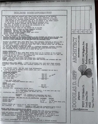 a view of a livingroom with wooden floor and furniture