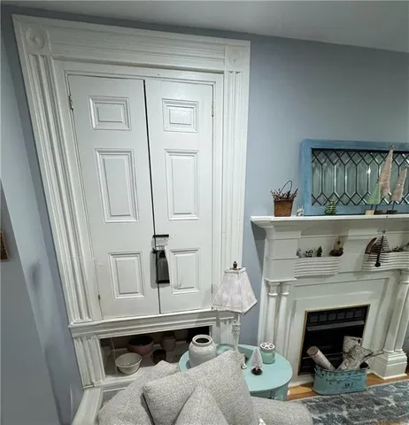 a room with a dresser and mirror