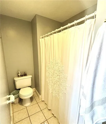 a bathroom with a toilet and a bathtub
