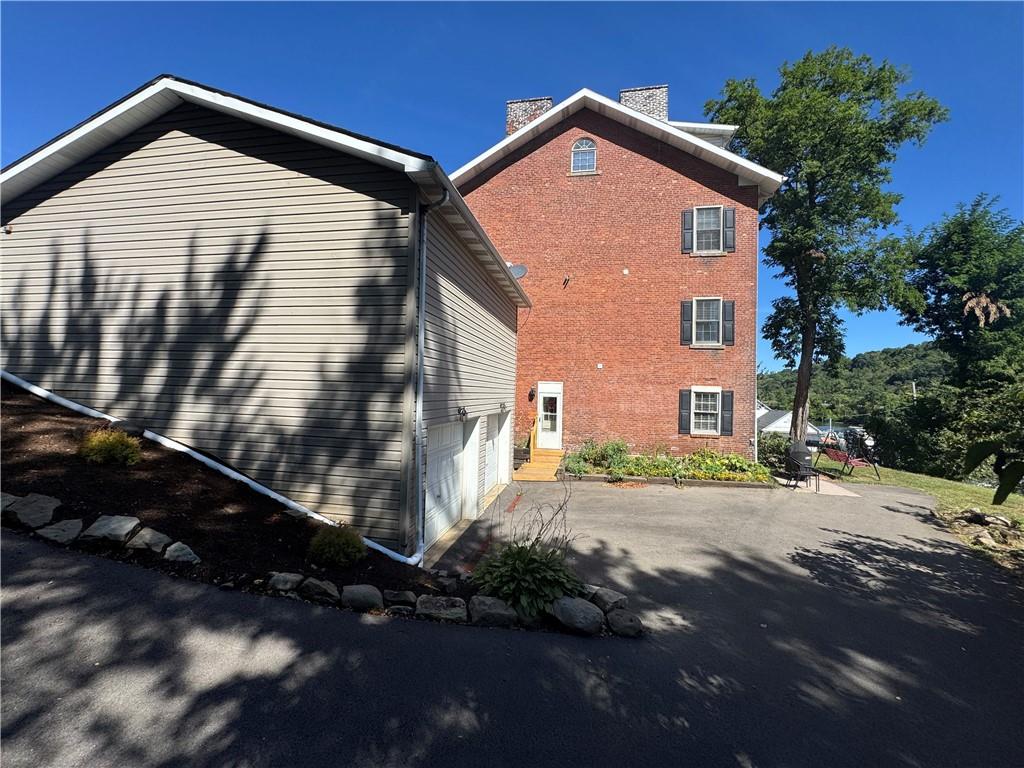 1319 Riverside Drive Beaver, PA 15009 - Photo 3 of 49 Side showing entrance to Unit 100 and bottom 2 garages