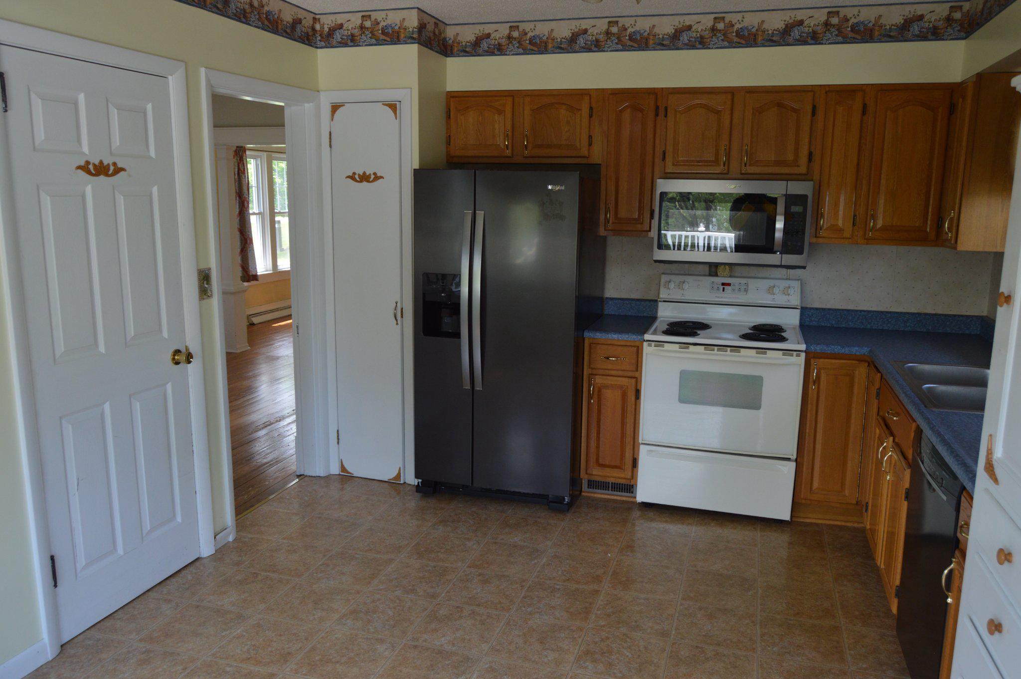 3225 Cold Springs Road Huntingdon, PA 16652 - Photo 17 of 40 a kitchen with stainless steel appliances granite countertop a refrigerator a stove and a sink
