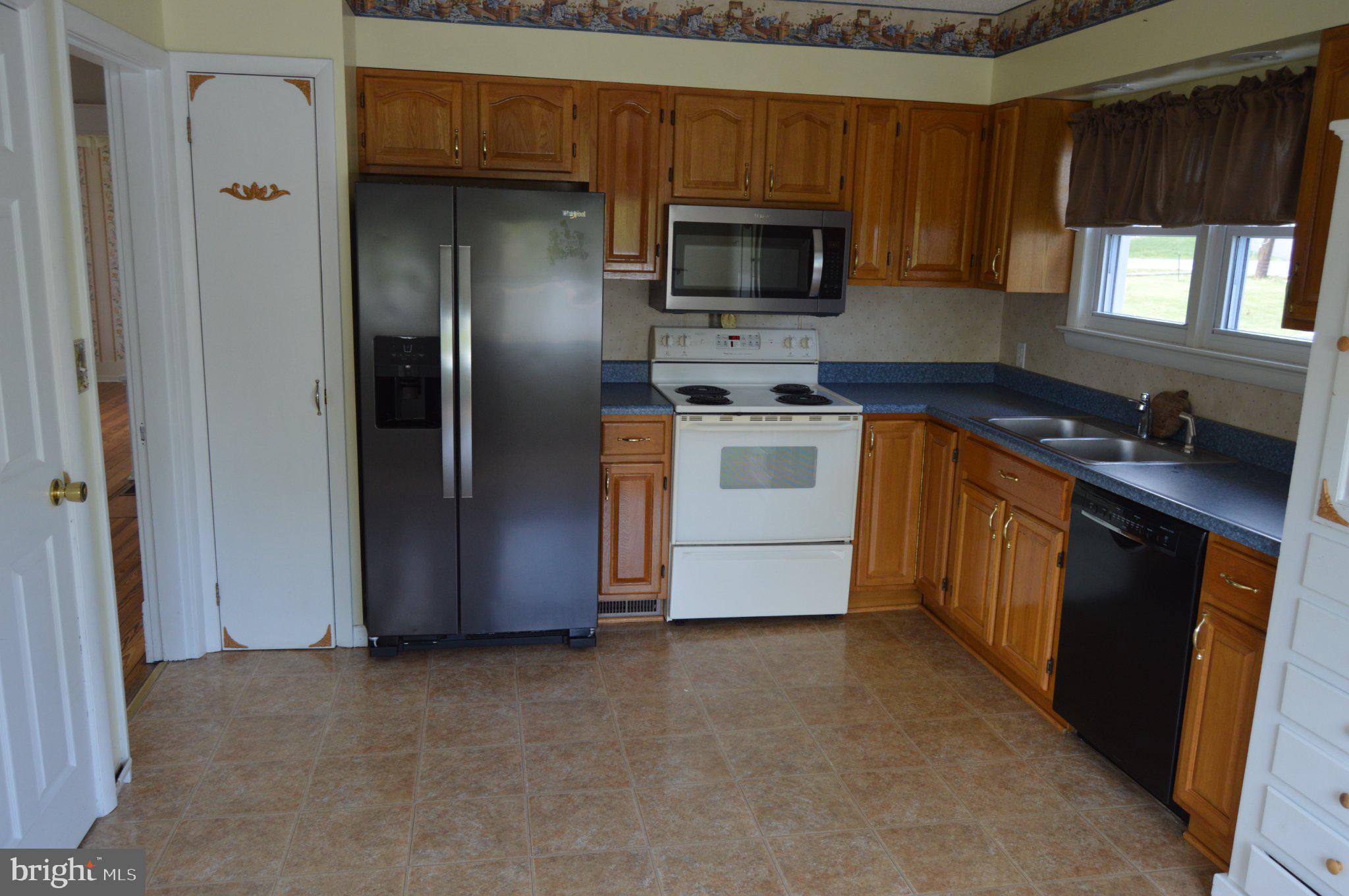 3225 Cold Springs Road Huntingdon, PA 16652 - Photo 18 of 40 a kitchen with stainless steel appliances a stove microwave and sink