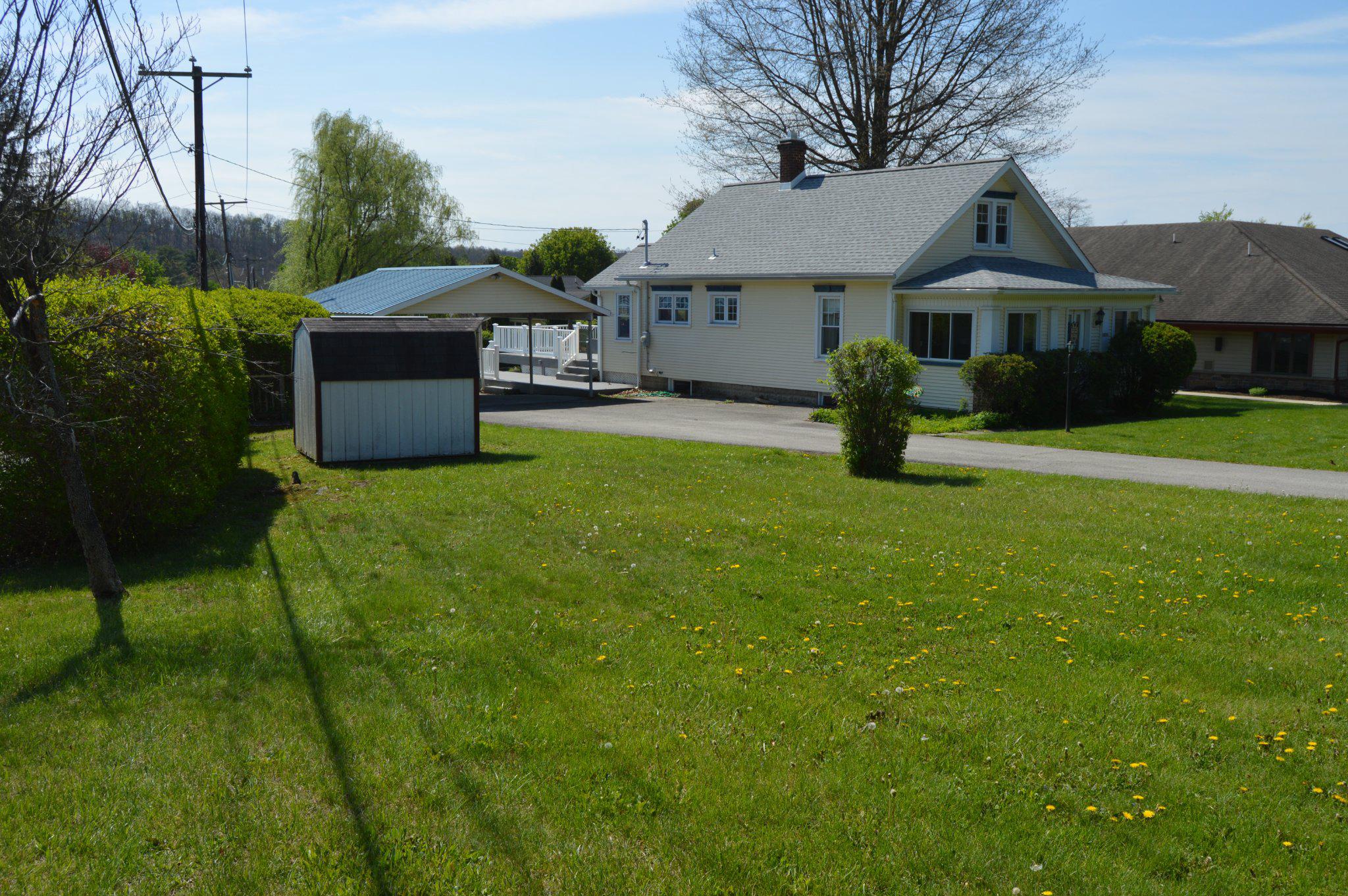 3225 Cold Springs Road Huntingdon, PA 16652 - Photo 6 of 40 a front view of a house with garden