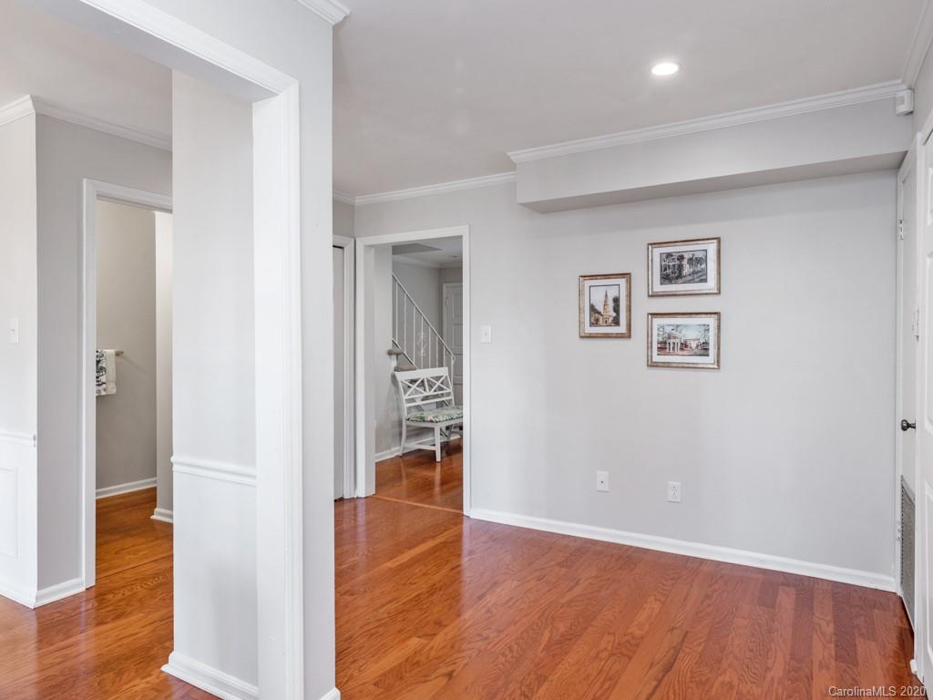 3516 Colony Road, Unit A Charlotte, NC 28211 - Photo 11 of 29 wooden floor in a hall with an entryway and a livingroom