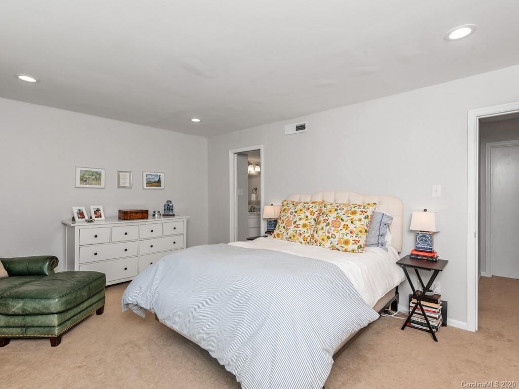 3516 Colony Road, Unit A Charlotte, NC 28211 - Photo 13 of 29 a bedroom with a bed and a chair in it