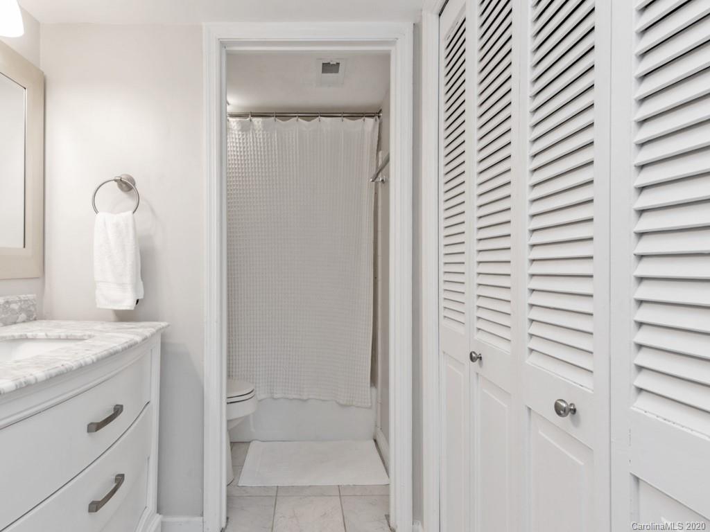 3516 Colony Road, Unit A Charlotte, NC 28211 - Photo 17 of 29 a bathroom with a granite countertop sink and a mirror
