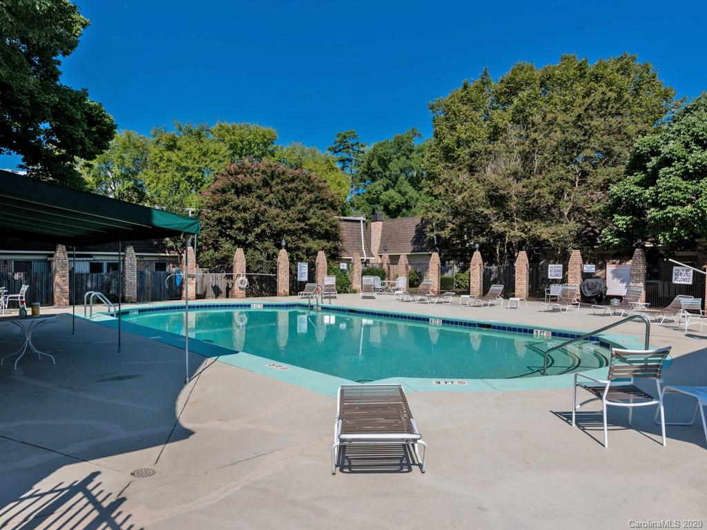 3516 Colony Road, Unit A Charlotte, NC 28211 - Photo 26 of 29 a view of a wooden chairs and table in the patio