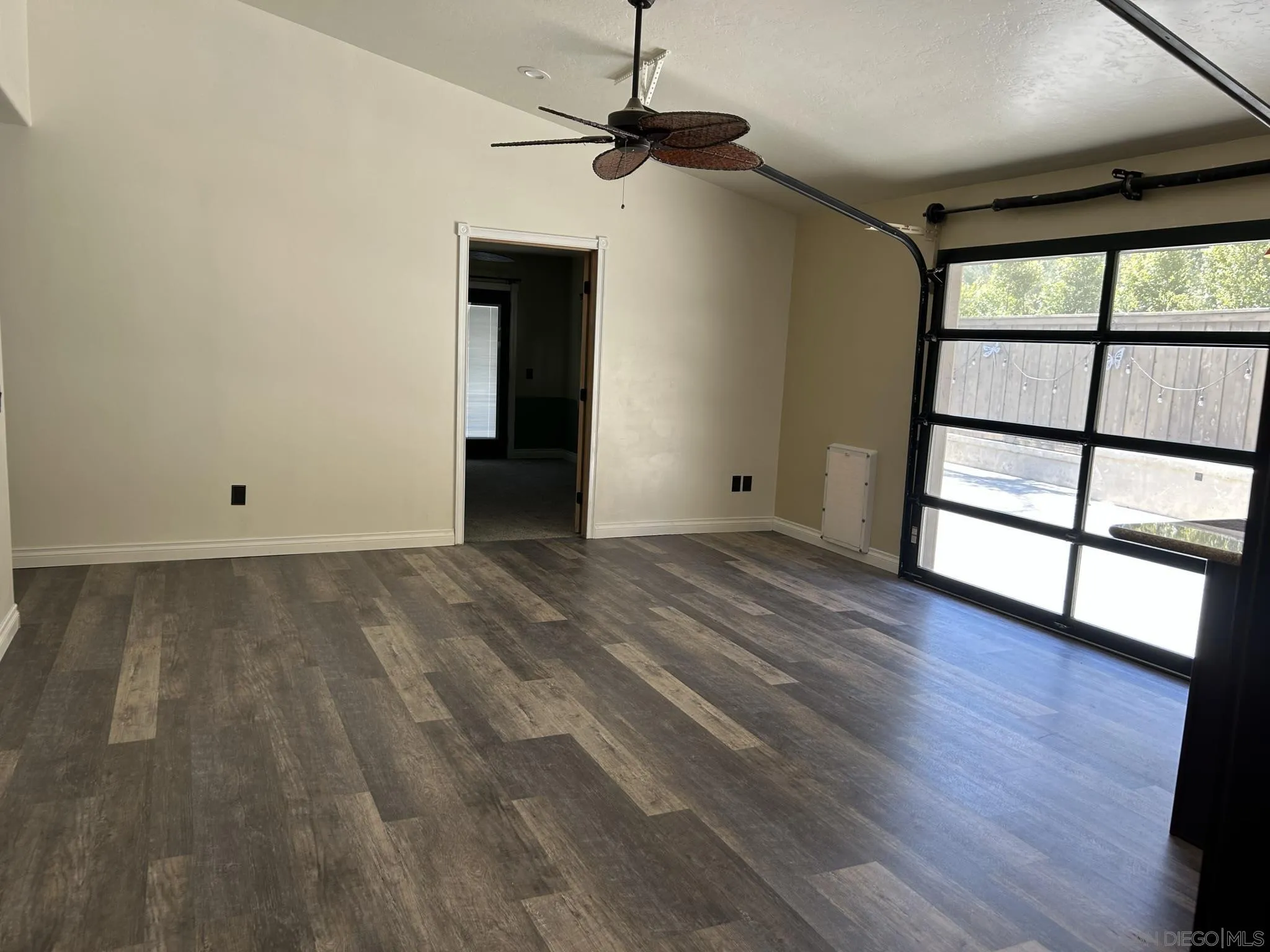 15408 Espola Road Poway, CA 92064 - Photo 15 of 27 a view of room with window and wooden floor