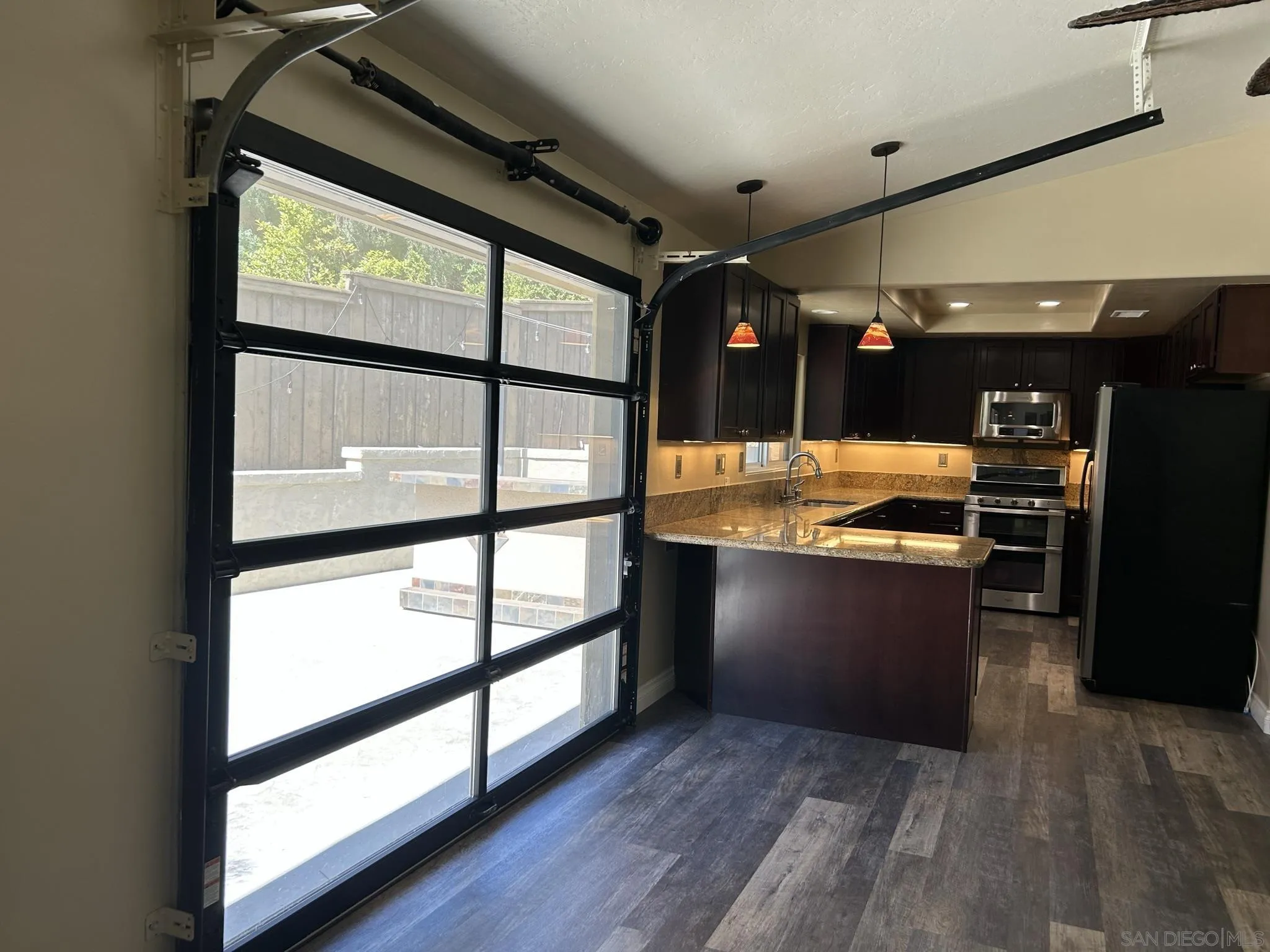 15408 Espola Road Poway, CA 92064 - Photo 16 of 27 a view of open kitchen with wooden floor