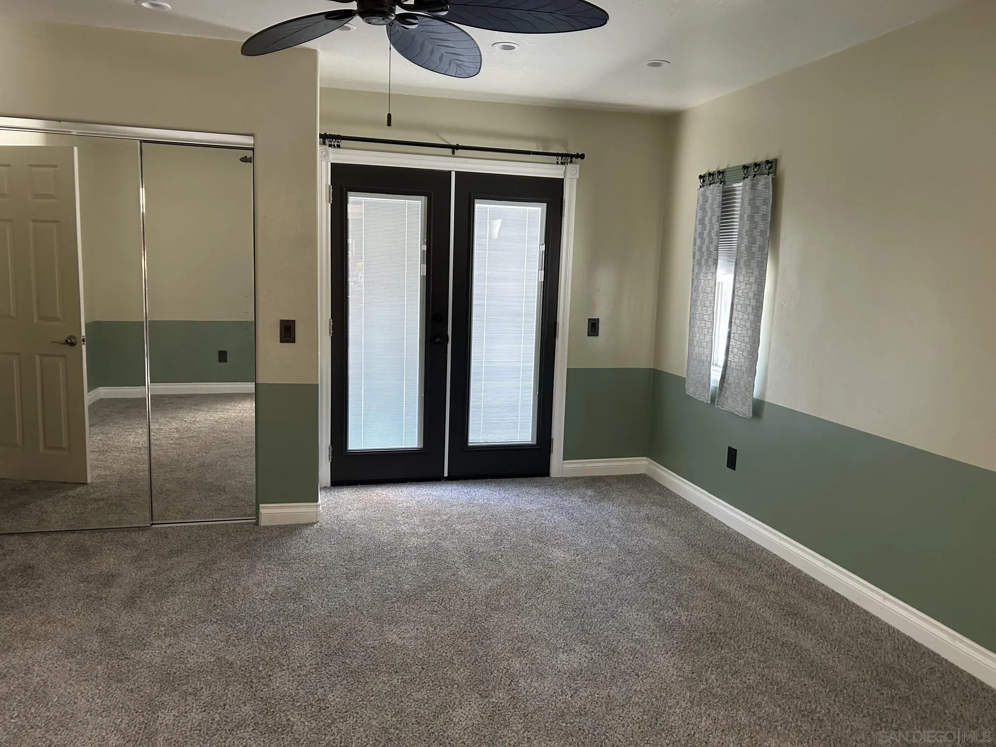 15408 Espola Road Poway, CA 92064 - Photo 17 of 27 an empty room with closet and windows
