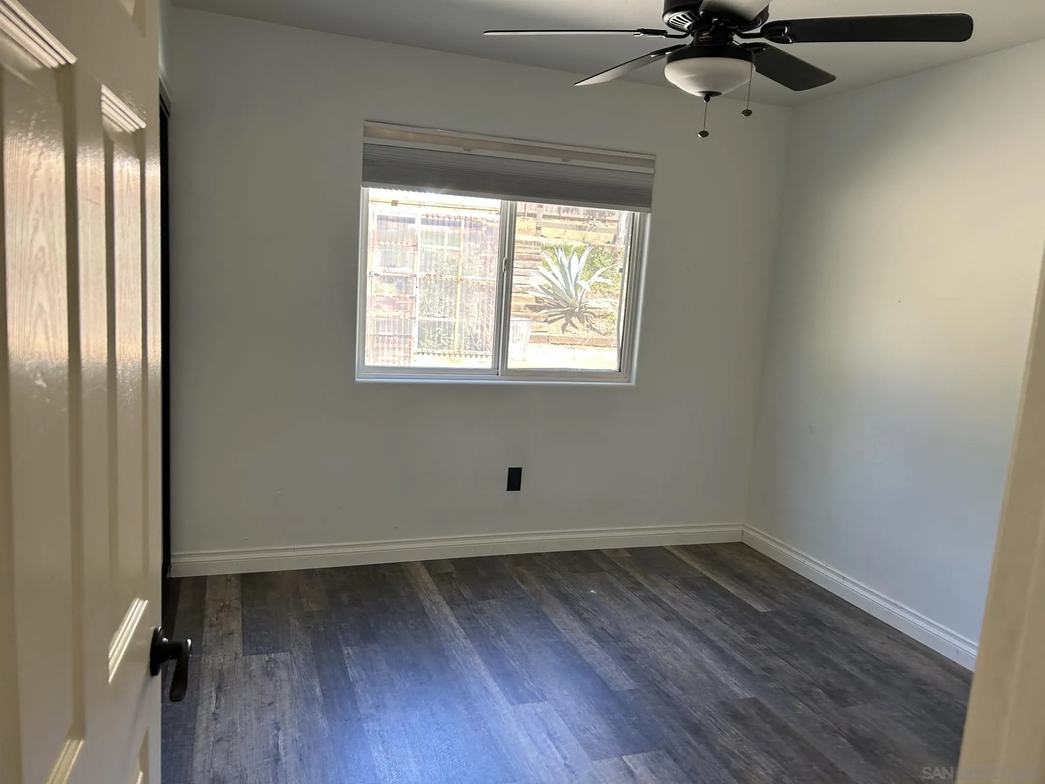 15408 Espola Road Poway, CA 92064 - Photo 24 of 27 wooden floor in an empty room with a window