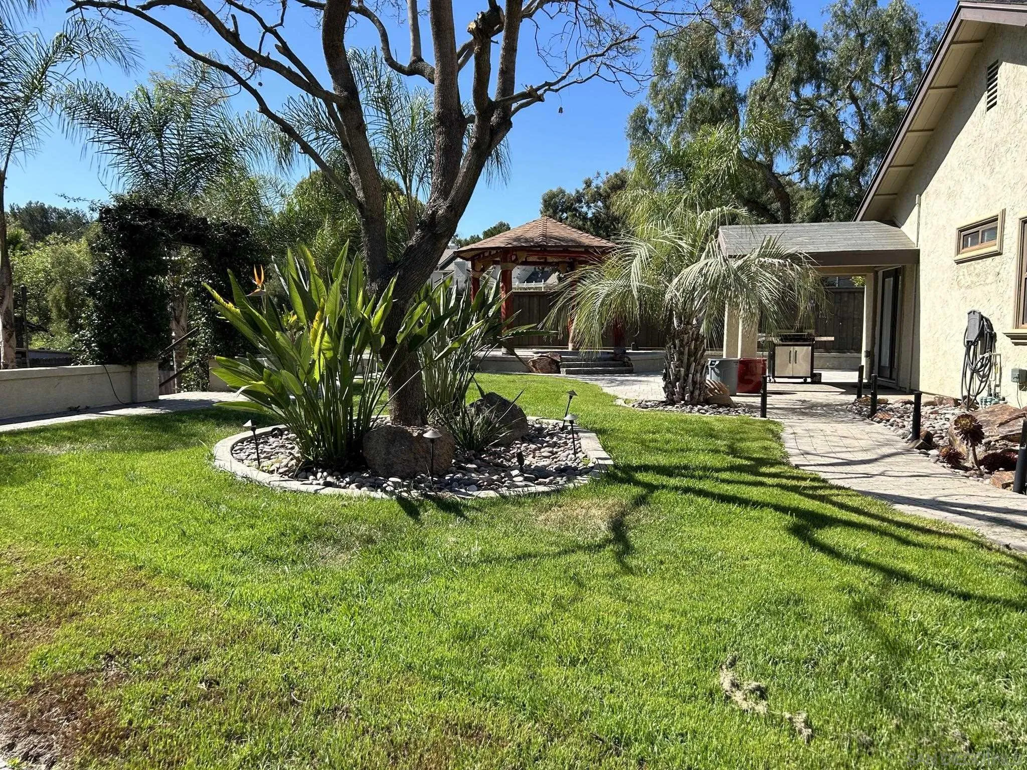 15408 Espola Road Poway, CA 92064 - Photo 3 of 27 a view of a house with backyard and sitting area