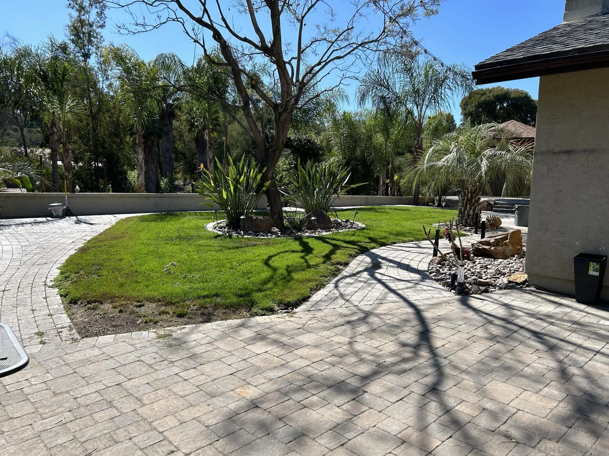 15408 Espola Road Poway, CA 92064 - Photo 4 of 27 a view of a backyard with sitting area