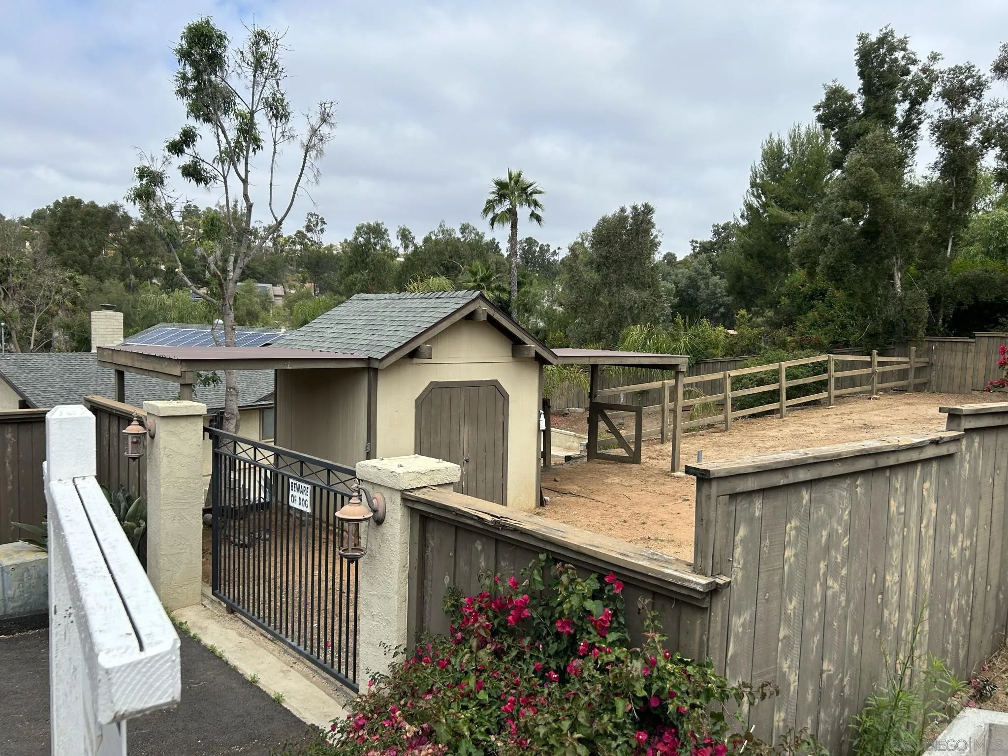15408 Espola Road Poway, CA 92064 - Photo 9 of 27 a view of a house with wooden deck and furniture