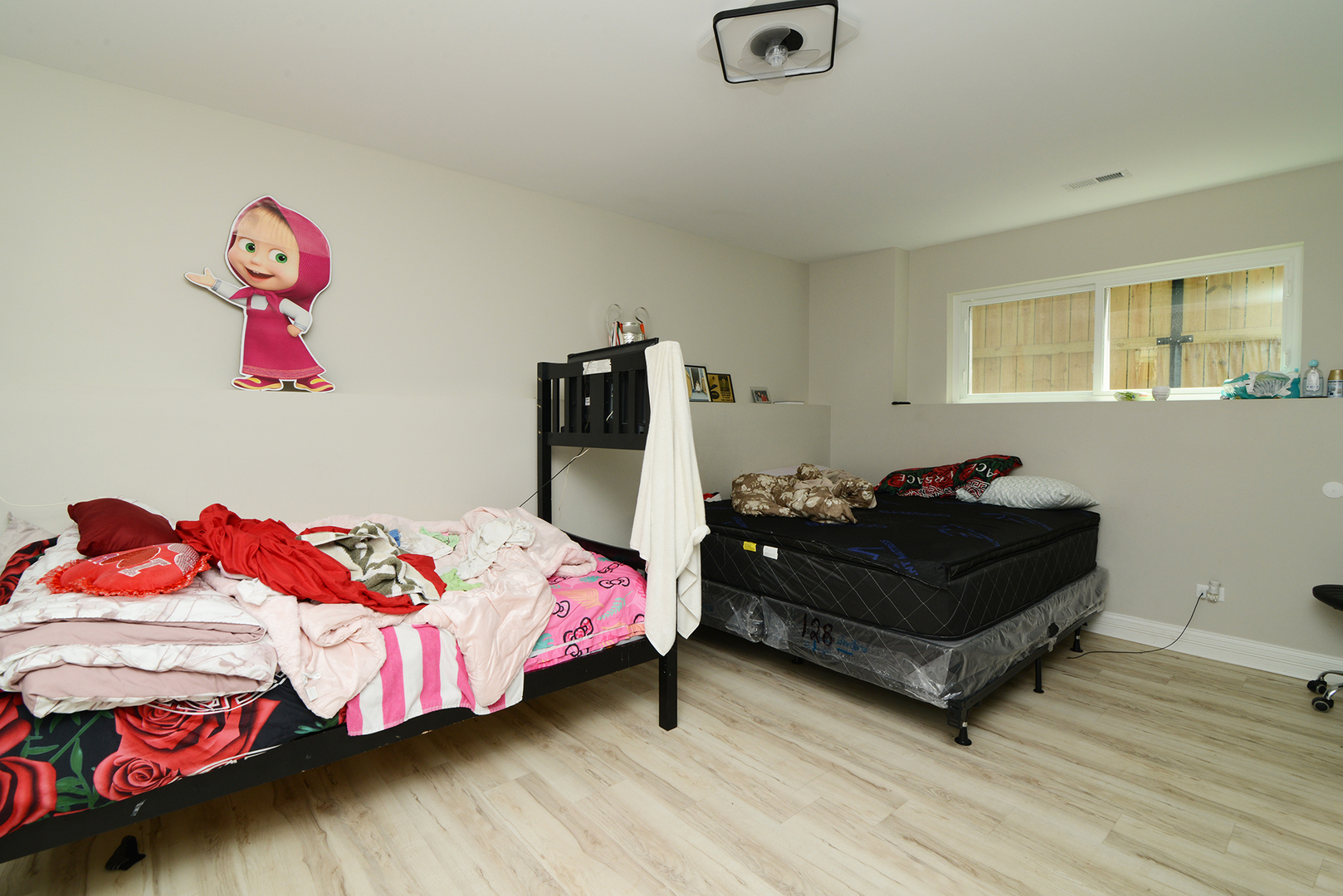 1051 North Springfield Avenue Chicago, IL 60651 - Photo 39 of 50 a bedroom with a bed and a couch