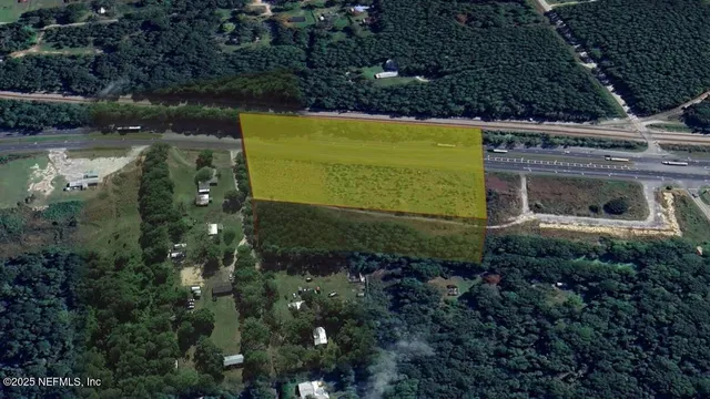 a view of a back yard of the house and front view of a house