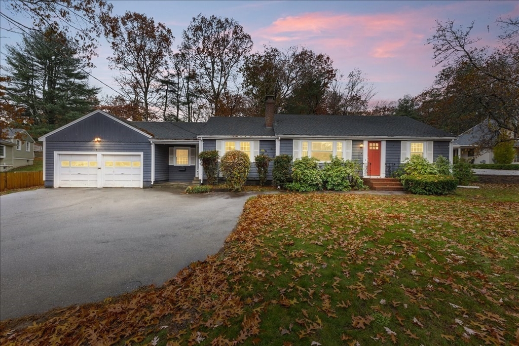 100 Whiting Street Hingham, MA 02043 - Photo 1 of 34 a front view of a house with a yard and garage