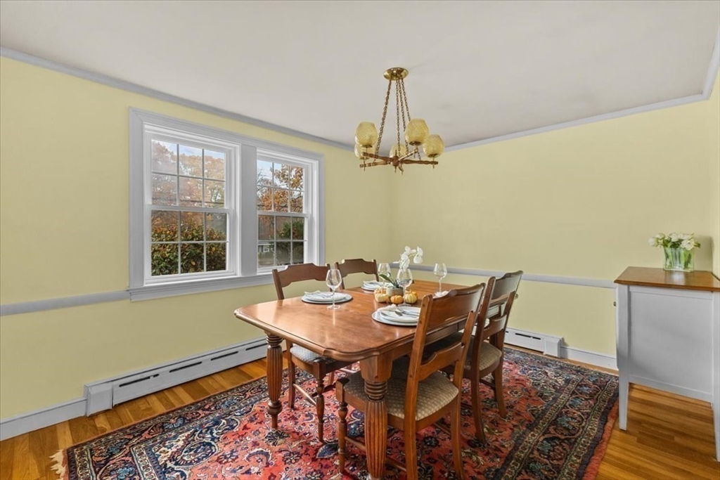 100 Whiting Street Hingham, MA 02043 - Photo 12 of 34 a view of a dining room with furniture window and wooden floor