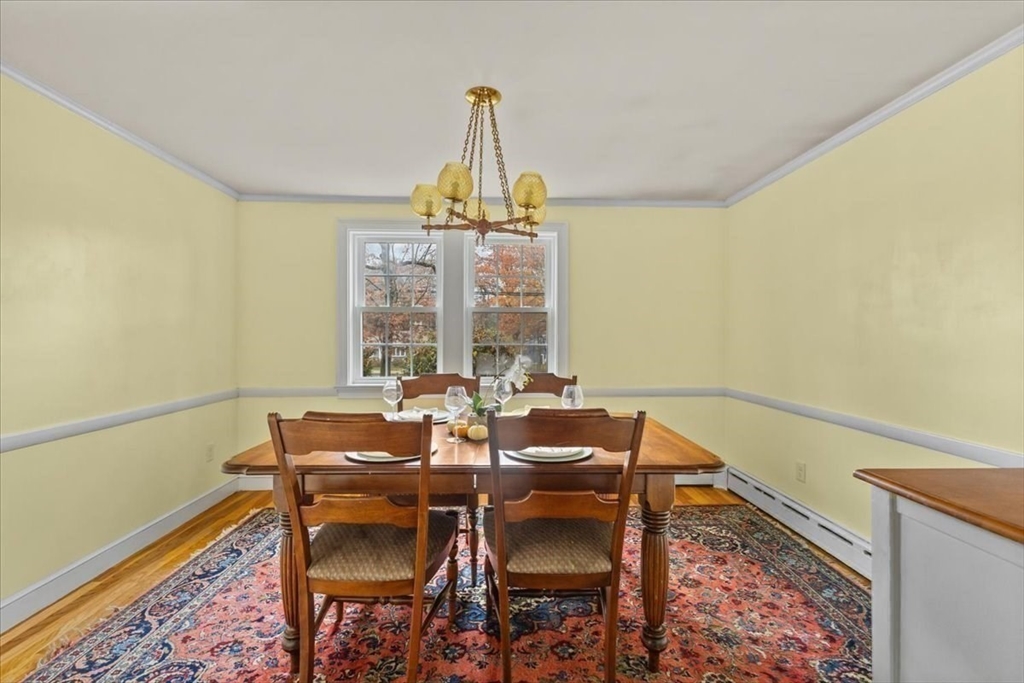 100 Whiting Street Hingham, MA 02043 - Photo 13 of 34 a dining room with chandelier