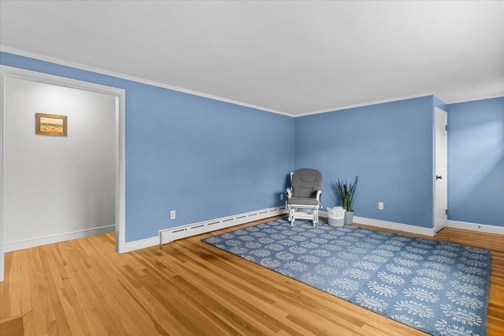 100 Whiting Street Hingham, MA 02043 - Photo 17 of 34 a bedroom with a bed and a window