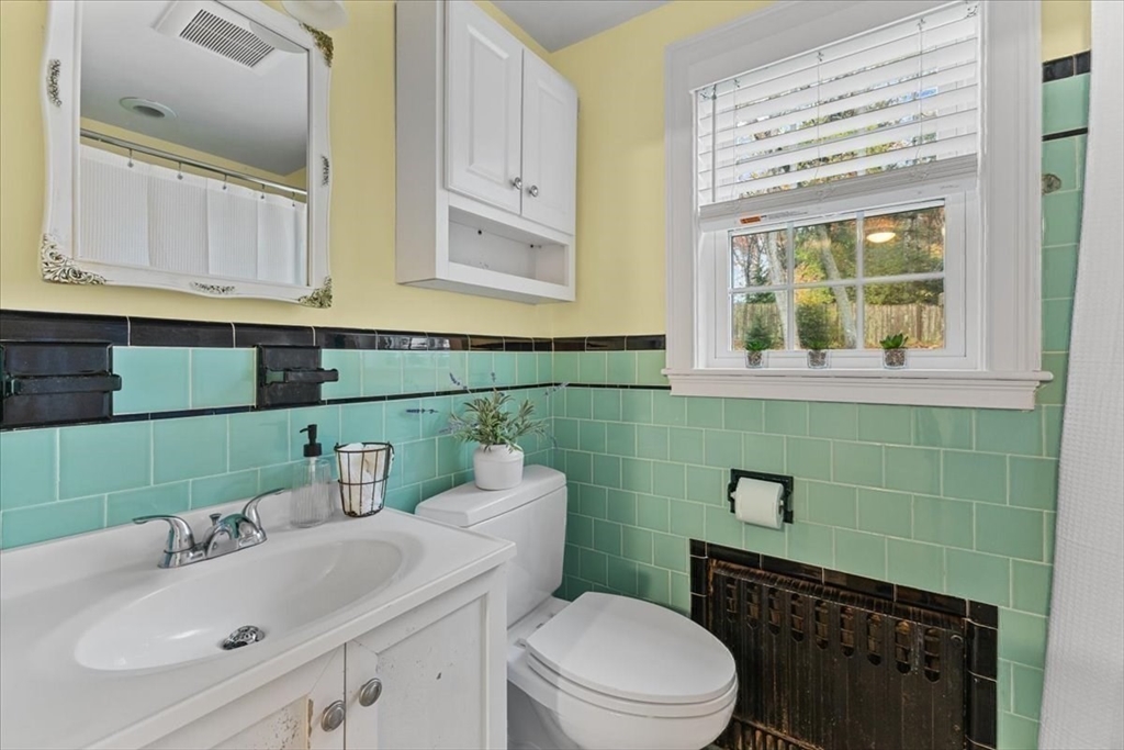 100 Whiting Street Hingham, MA 02043 - Photo 21 of 34 a bathroom with a sink a toilet and mirror
