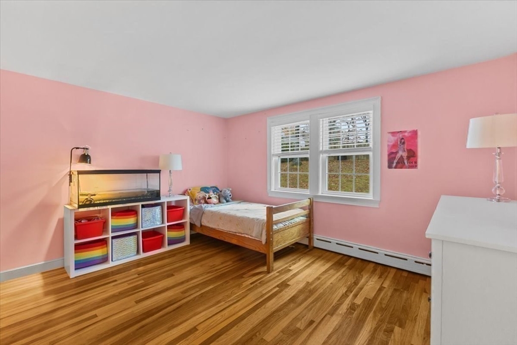 100 Whiting Street Hingham, MA 02043 - Photo 25 of 34 a bedroom with furniture and a window