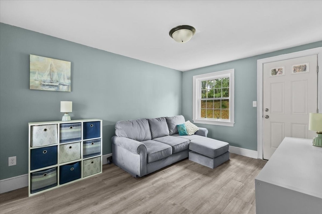 100 Whiting Street Hingham, MA 02043 - Photo 4 of 34 a living room with furniture and a window