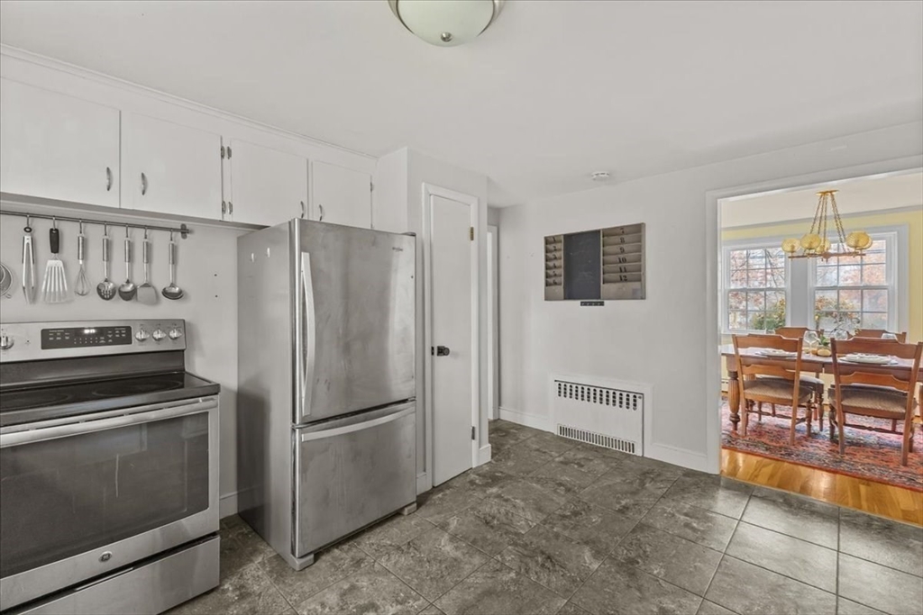 100 Whiting Street Hingham, MA 02043 - Photo 10 of 34 a kitchen with stainless steel appliances a refrigerator and stove