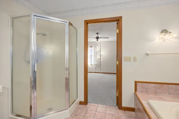a bathroom with a shower and a sink