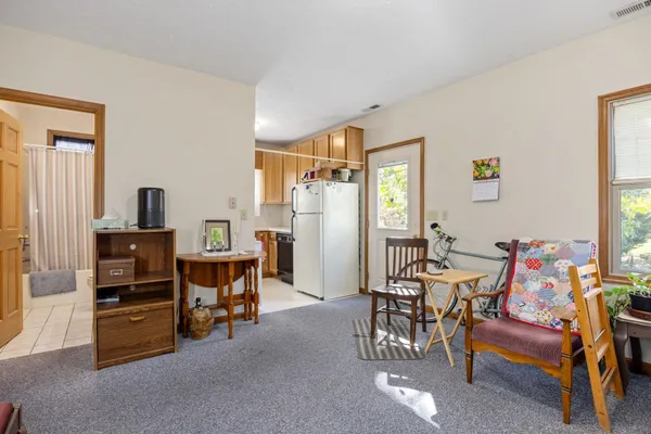 a bathroom with a sink a toilet and shower curtain