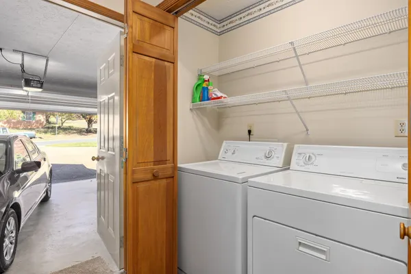 a bedroom with furniture and a mirror