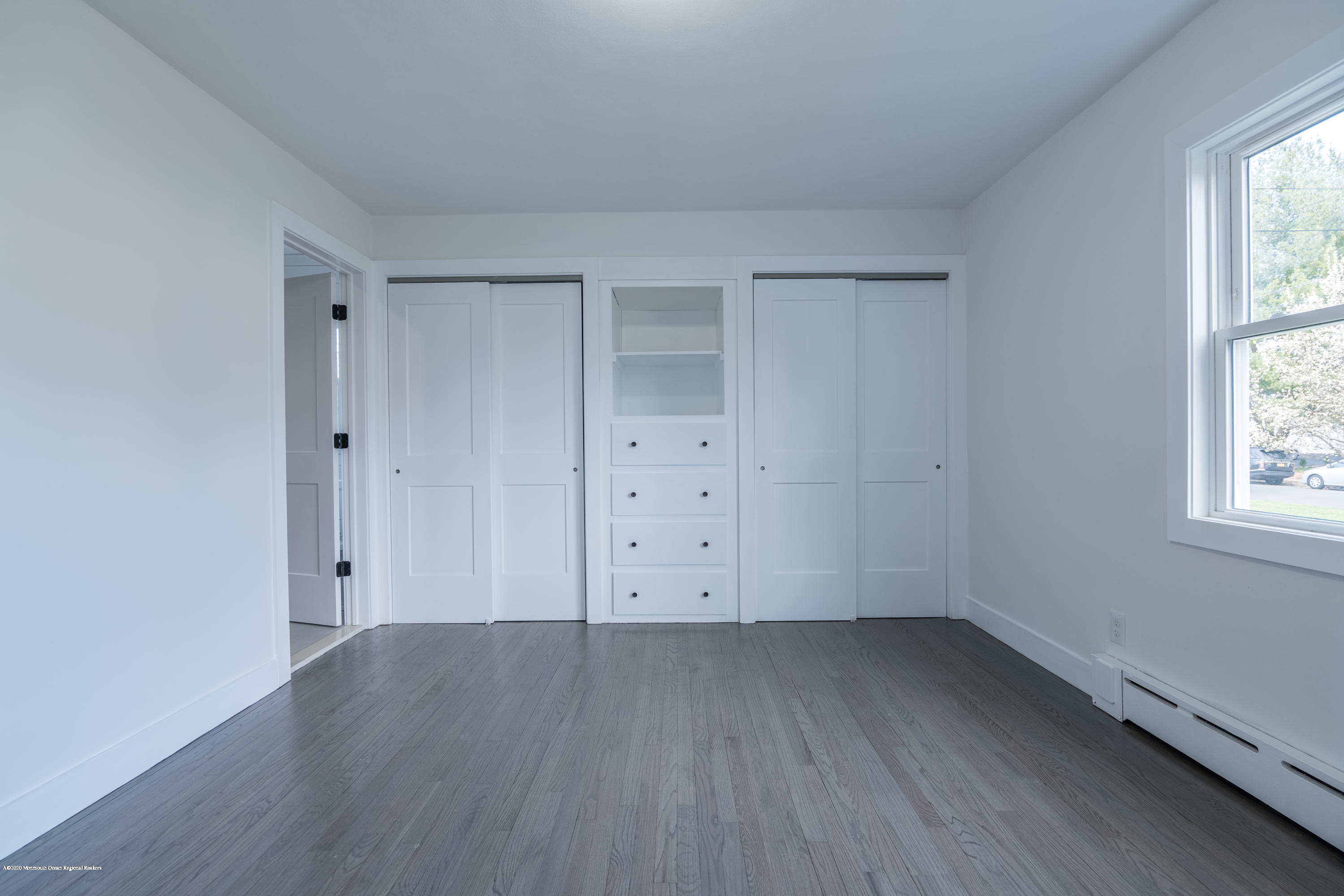 15 Johnson Road Lawrence Township, NJ 08648 - Photo 15 of 39 an empty room with wooden floor and window