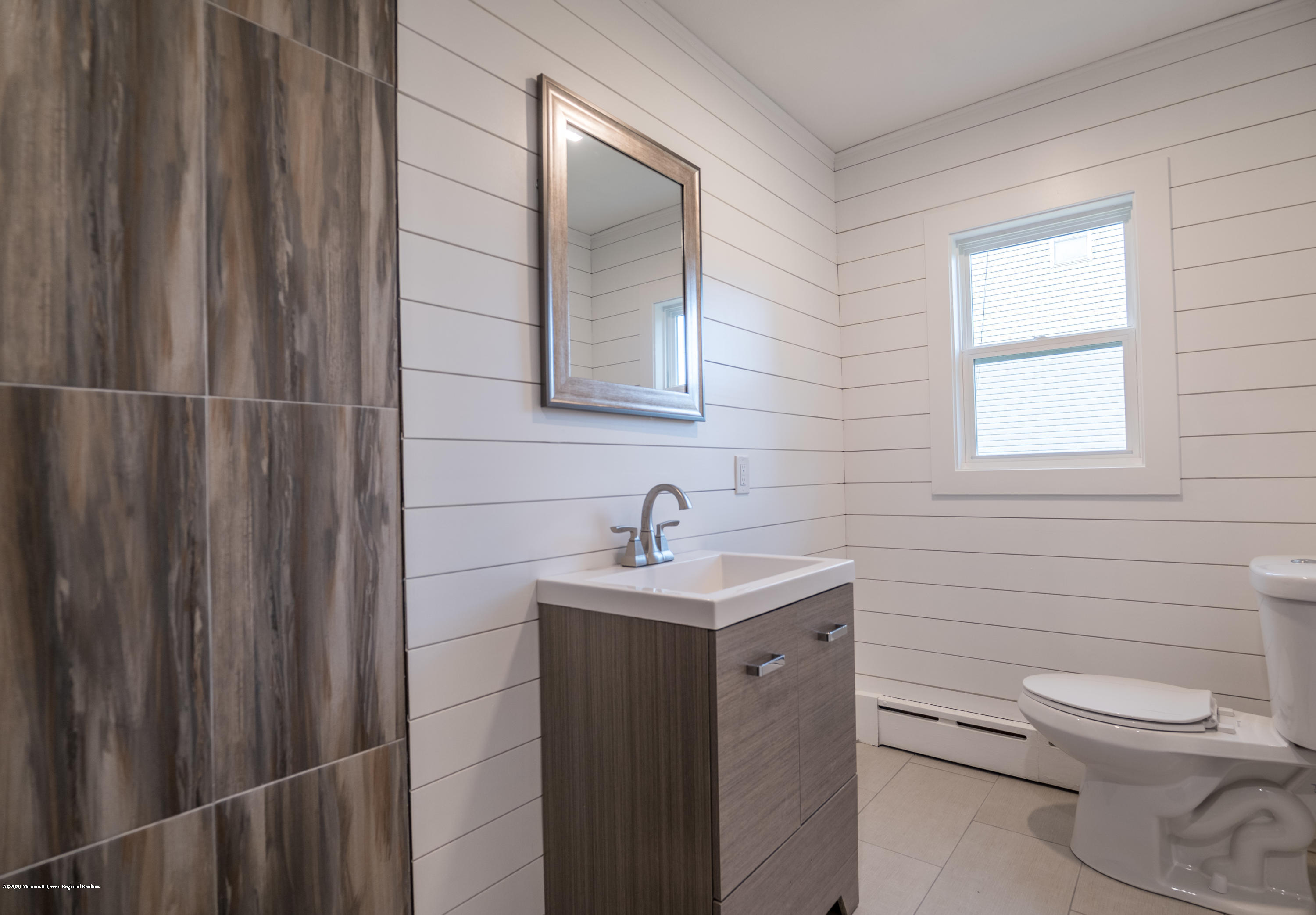 15 Johnson Road Lawrence Township, NJ 08648 - Photo 17 of 39 a bathroom with a toilet sink vanity and mirror