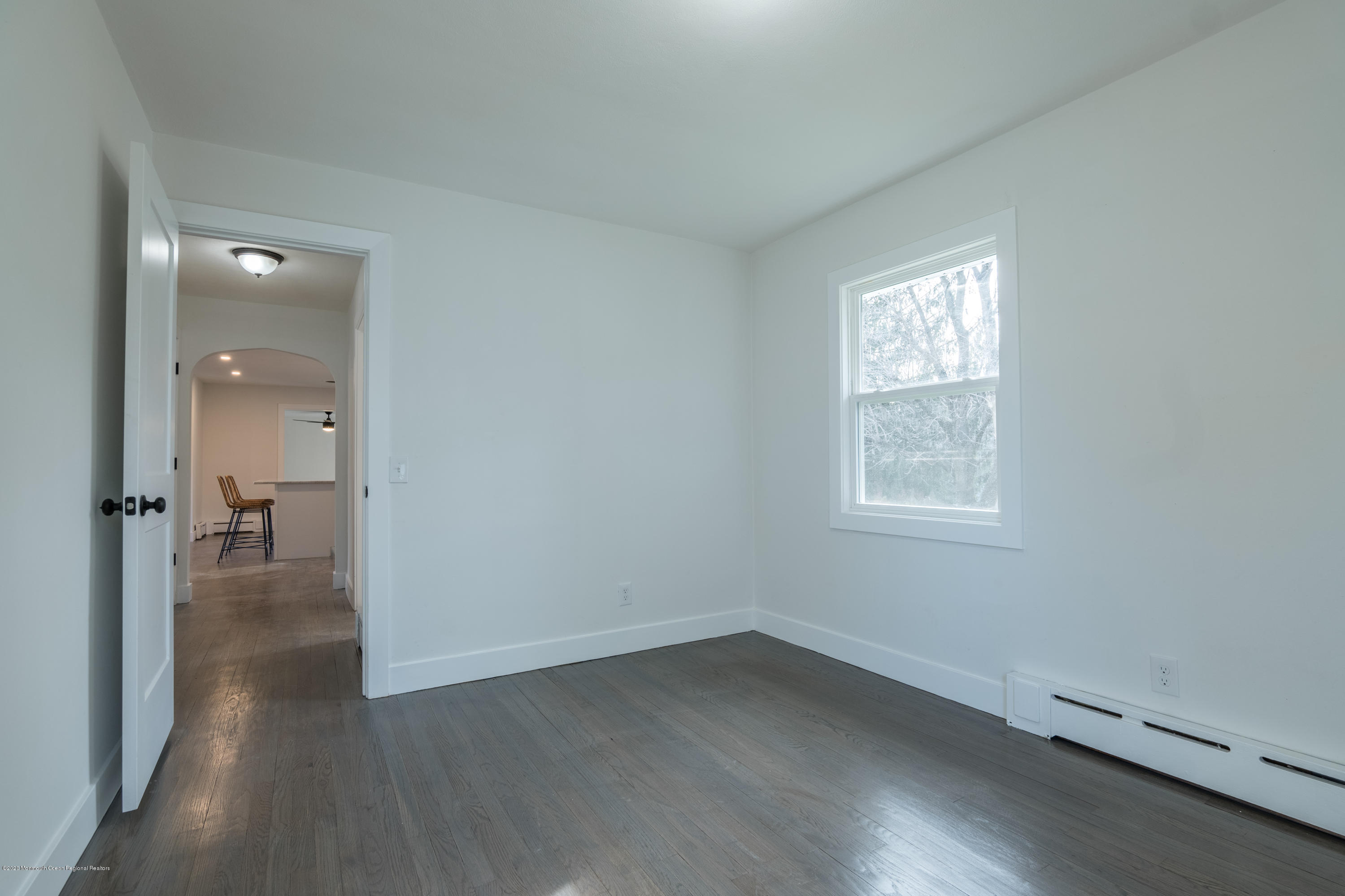 15 Johnson Road Lawrence Township, NJ 08648 - Photo 20 of 39 an empty room with wooden floor and a bathroom