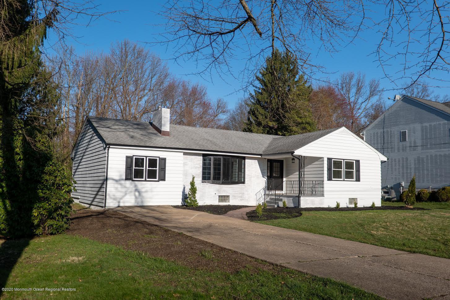 15 Johnson Road Lawrence Township, NJ 08648 - Photo 2 of 39 a front view of a house with a yard and garage