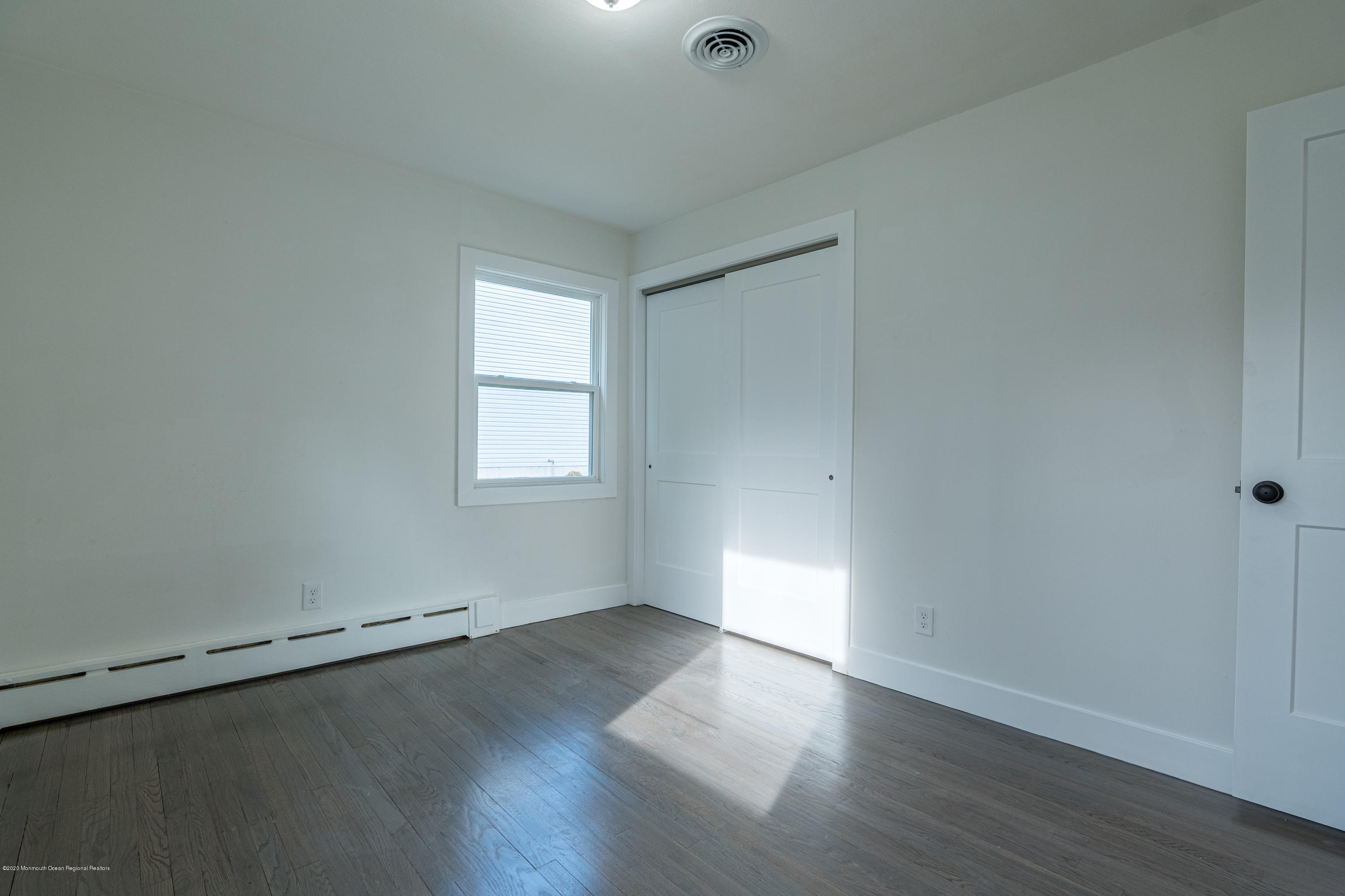 15 Johnson Road Lawrence Township, NJ 08648 - Photo 22 of 39 an empty room with wooden floor and windows