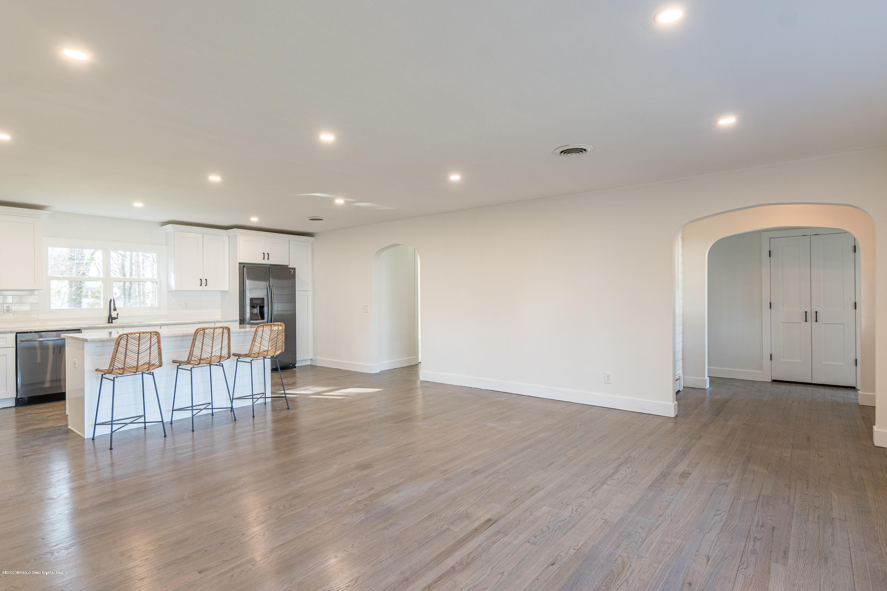 15 Johnson Road Lawrence Township, NJ 08648 - Photo 6 of 39 an empty room with wooden floor and a kitchen