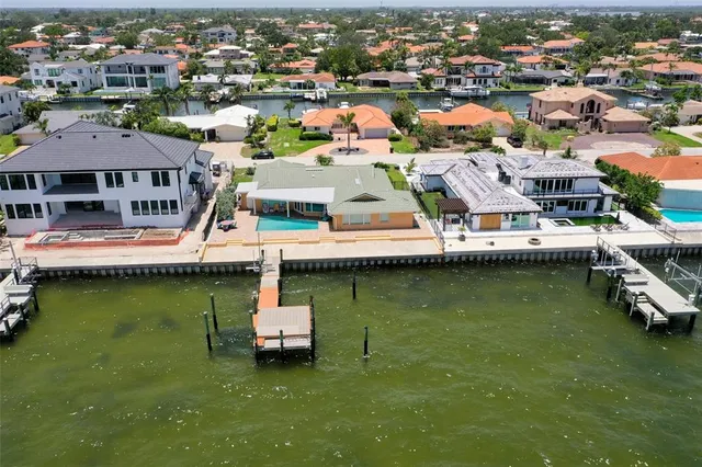 an aerial view of a house with a lake view