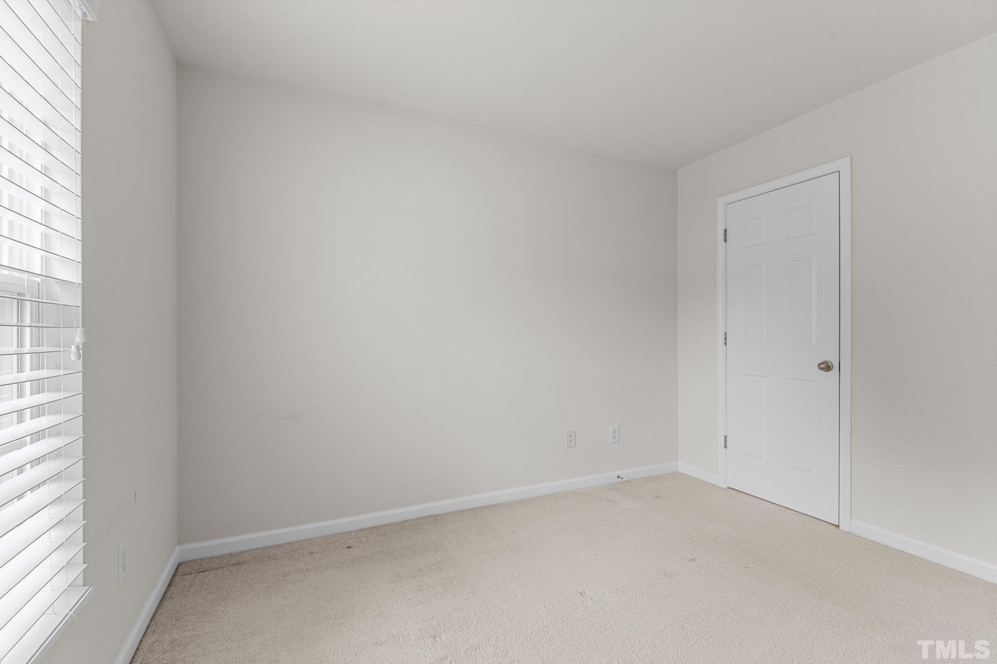 7154 Racine Way Raleigh, NC 27615 - Photo 24 of 31 an empty room with a window