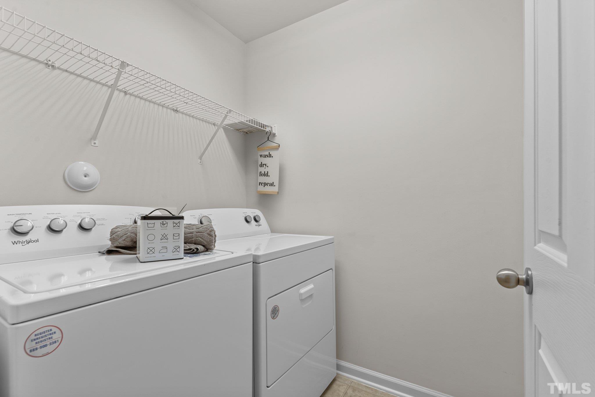 7154 Racine Way Raleigh, NC 27615 - Photo 26 of 31 a utility room with dryer and washer