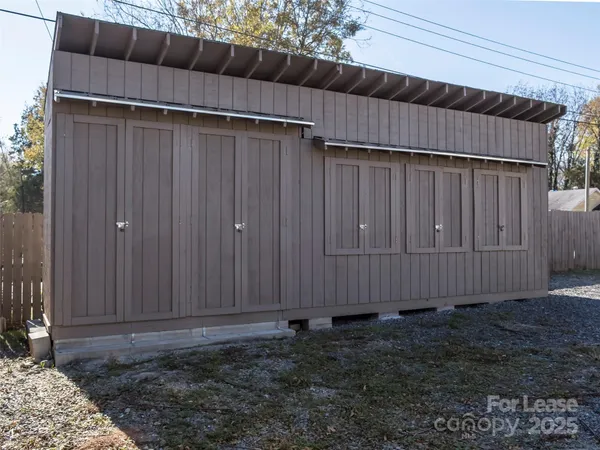 a view of outdoor space with wooden fence