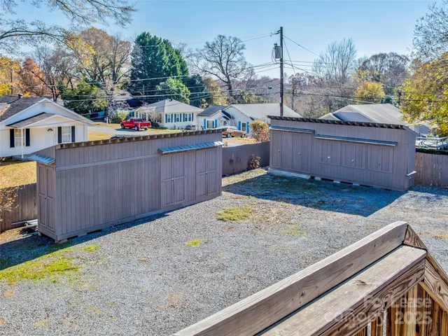 a view of a backyard with sitting area