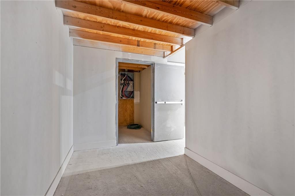 3208 Smallman Street Pittsburgh, PA 15201 - Photo 15 of 17 a view of a hallway with wooden shelves