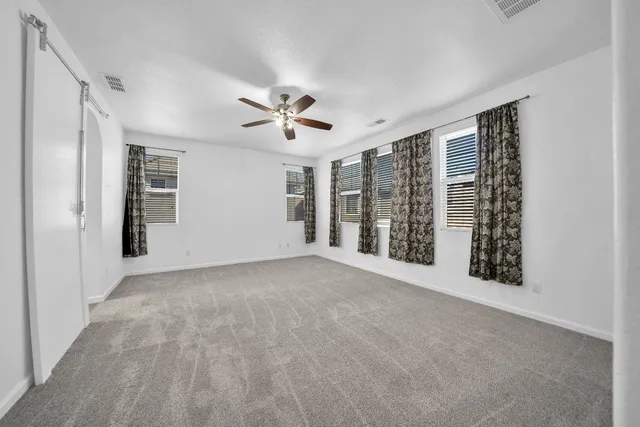 a house that has a tree in front of it